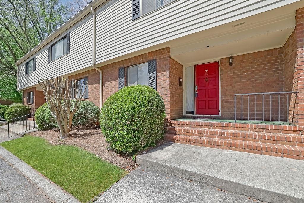 3312 Northcrest Road, Unit C Atlanta, GA 30340 - Photo 11 of 27 a view of a house with a small yard and plants