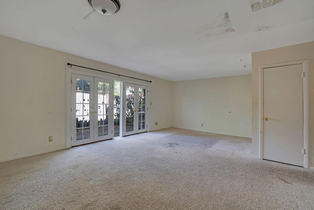 3312 Northcrest Road, Unit C Atlanta, GA 30340 - Photo 14 of 27 a view of an empty room with glass door