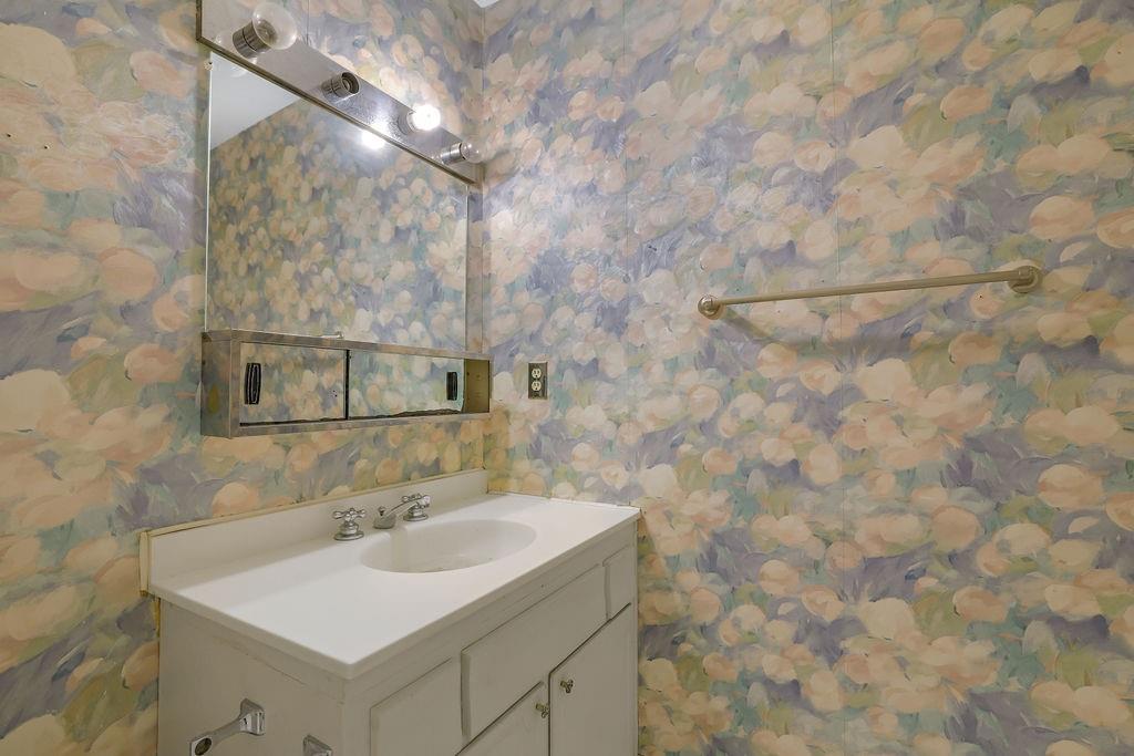 3312 Northcrest Road, Unit C Atlanta, GA 30340 - Photo 23 of 27 a bathroom with a sink and mirror