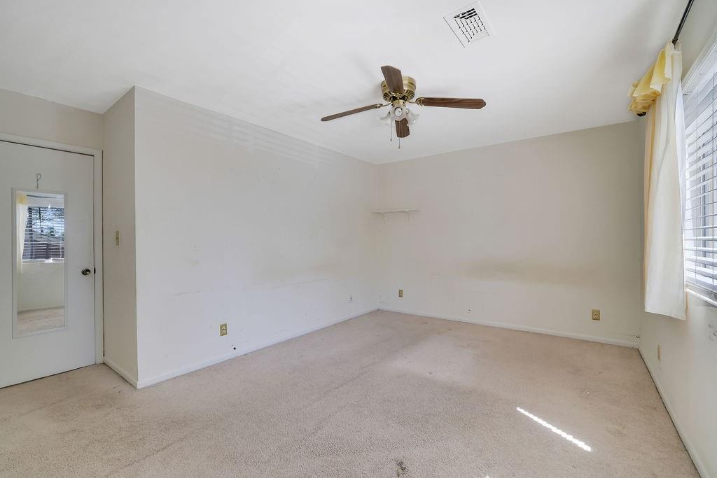 3312 Northcrest Road, Unit C Atlanta, GA 30340 - Photo 25 of 27 an empty room with windows and fan