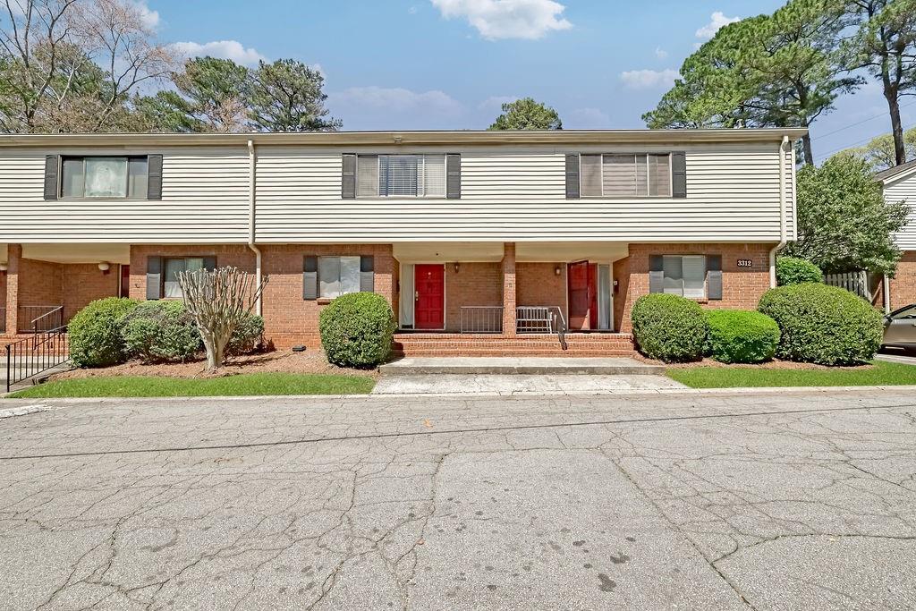 3312 Northcrest Road, Unit C Atlanta, GA 30340 - Photo 9 of 27 a front view of a house with garden