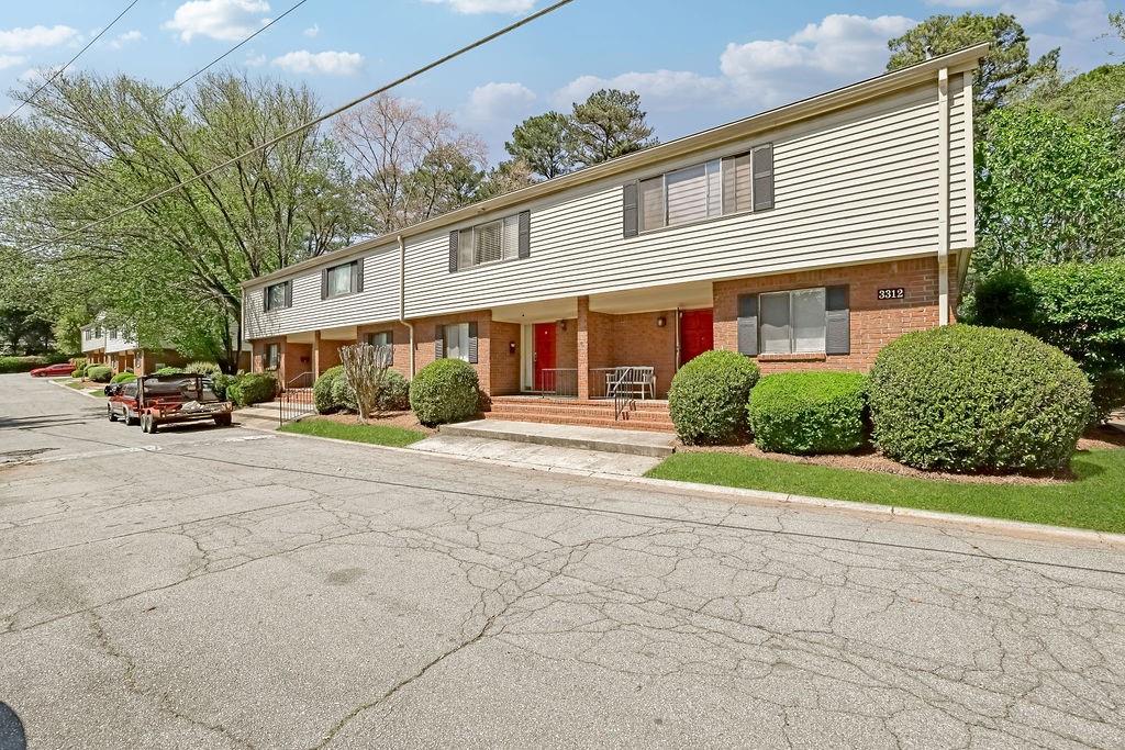 3312 Northcrest Road, Unit C Atlanta, GA 30340 - Photo 10 of 27 a front view of a building with a garden and plants