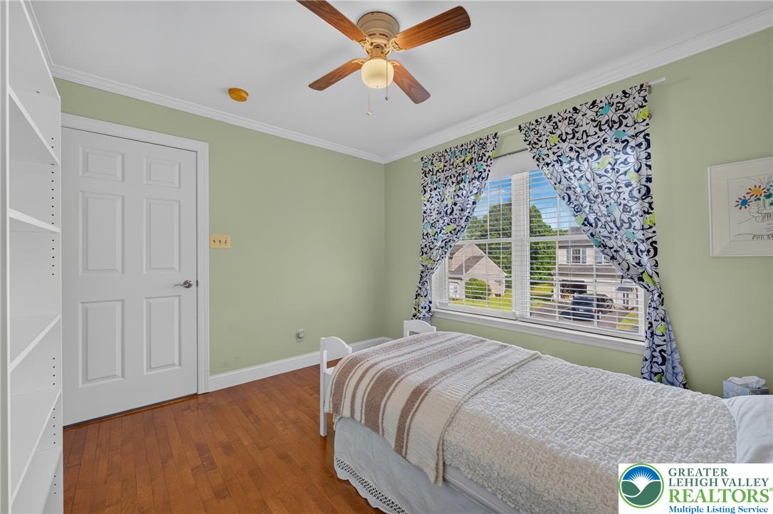 1702 Red Bud Road Quakertown, PA 18951 - Photo 31 of 68 Hardwood flooring extends through this cheerful room, illuminated by natural light and overhead fan.
