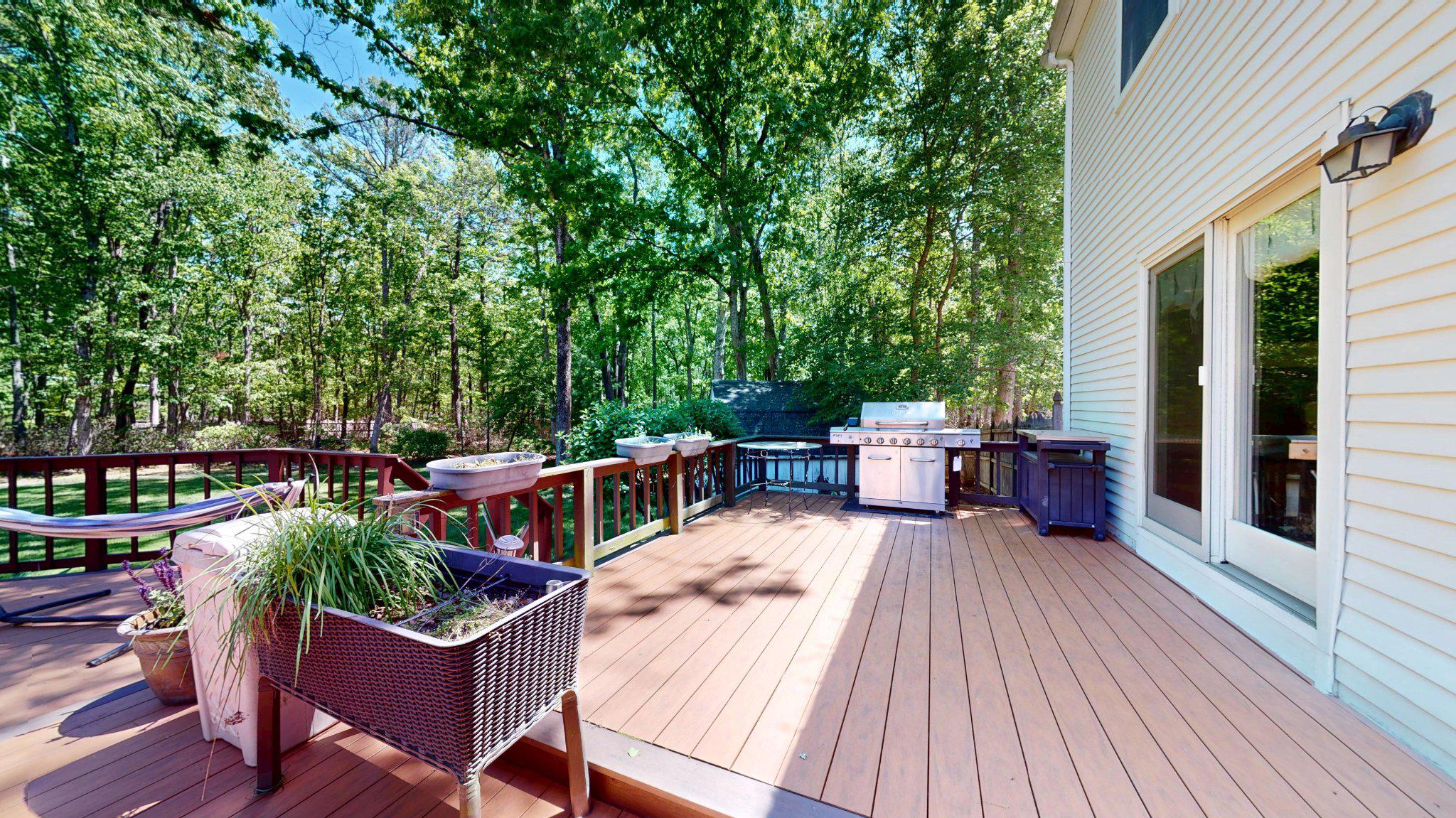 3 Colonial Court Medford, NJ 08055 - Photo 74 of 89 Serene deck surrounded by lush greenery.