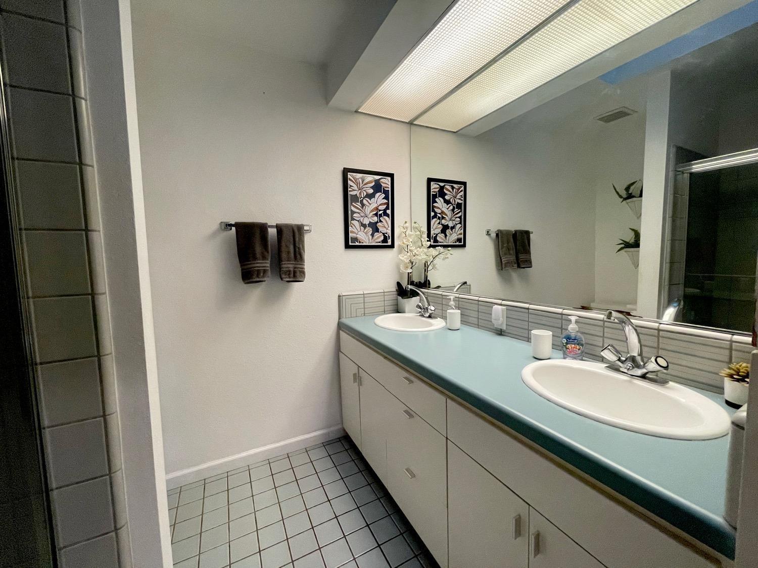 1956 Richert Avenue Clovis, CA 93611 - Photo 11 of 18 a bathroom with a sink double vanity and a mirror