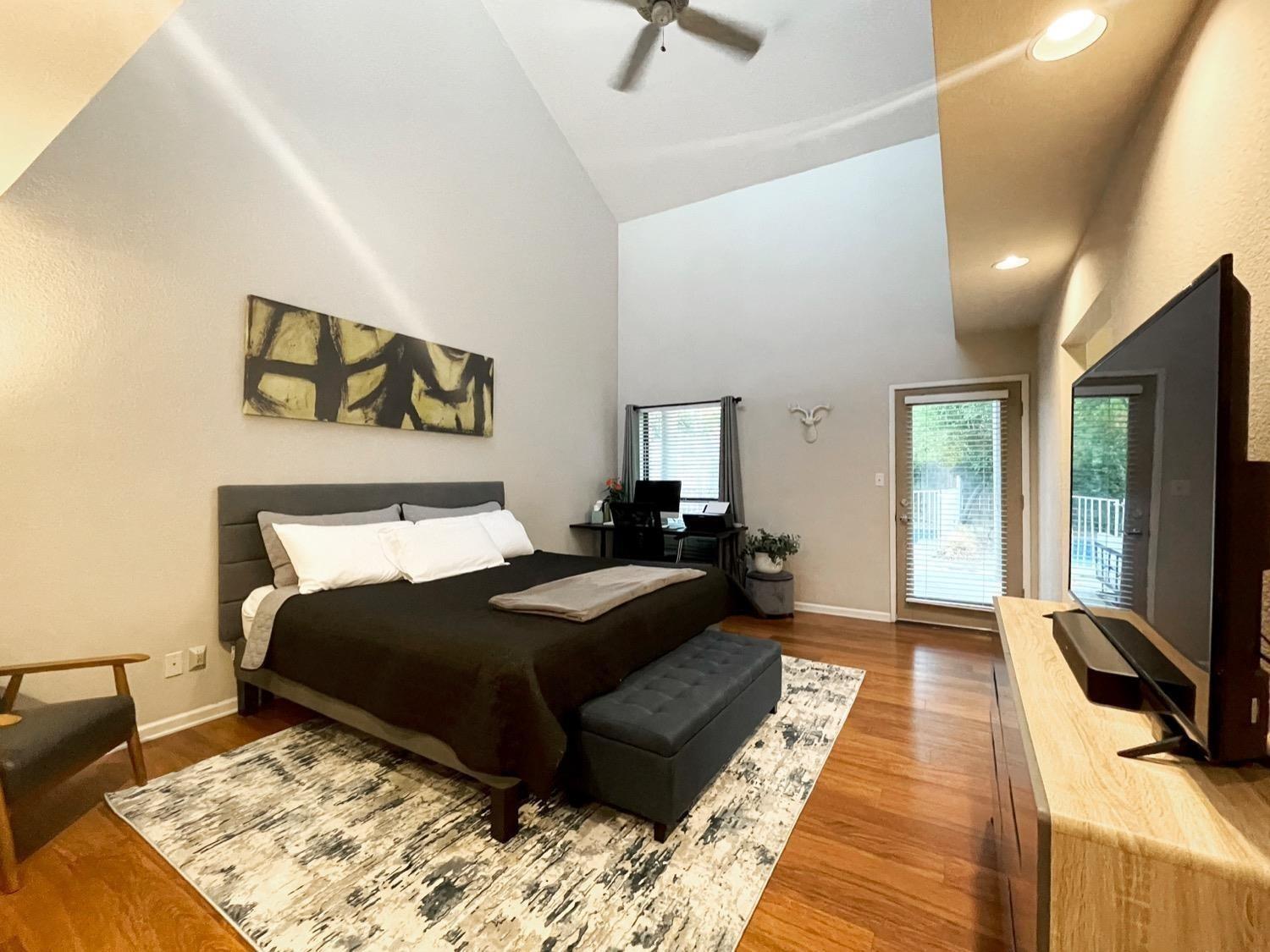 1956 Richert Avenue Clovis, CA 93611 - Photo 12 of 18 a bedroom with a large bed and a couch