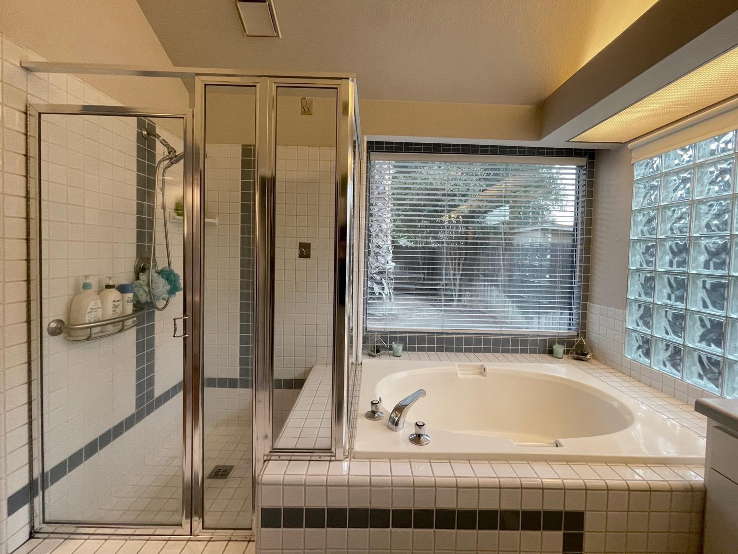 1956 Richert Avenue Clovis, CA 93611 - Photo 14 of 18 a bathroom with a bathtub and shower