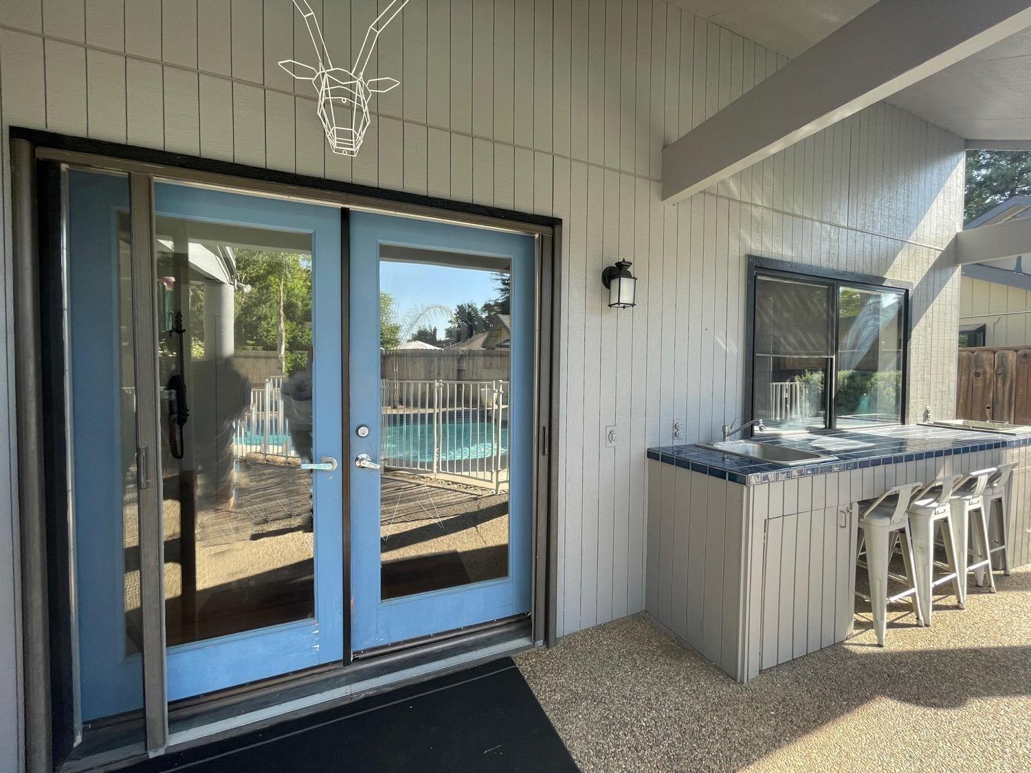 1956 Richert Avenue Clovis, CA 93611 - Photo 15 of 18 a kitchen with stainless steel appliances granite countertop a sink and cabinets