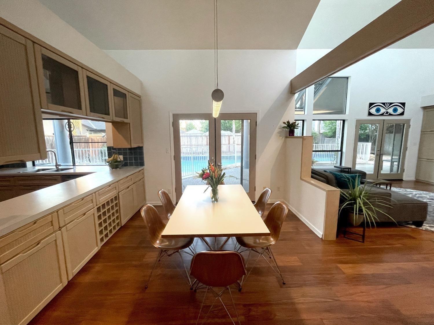 1956 Richert Avenue Clovis, CA 93611 - Photo 6 of 18 a large kitchen with kitchen island a white counter space a sink a window and stainless steel appliances