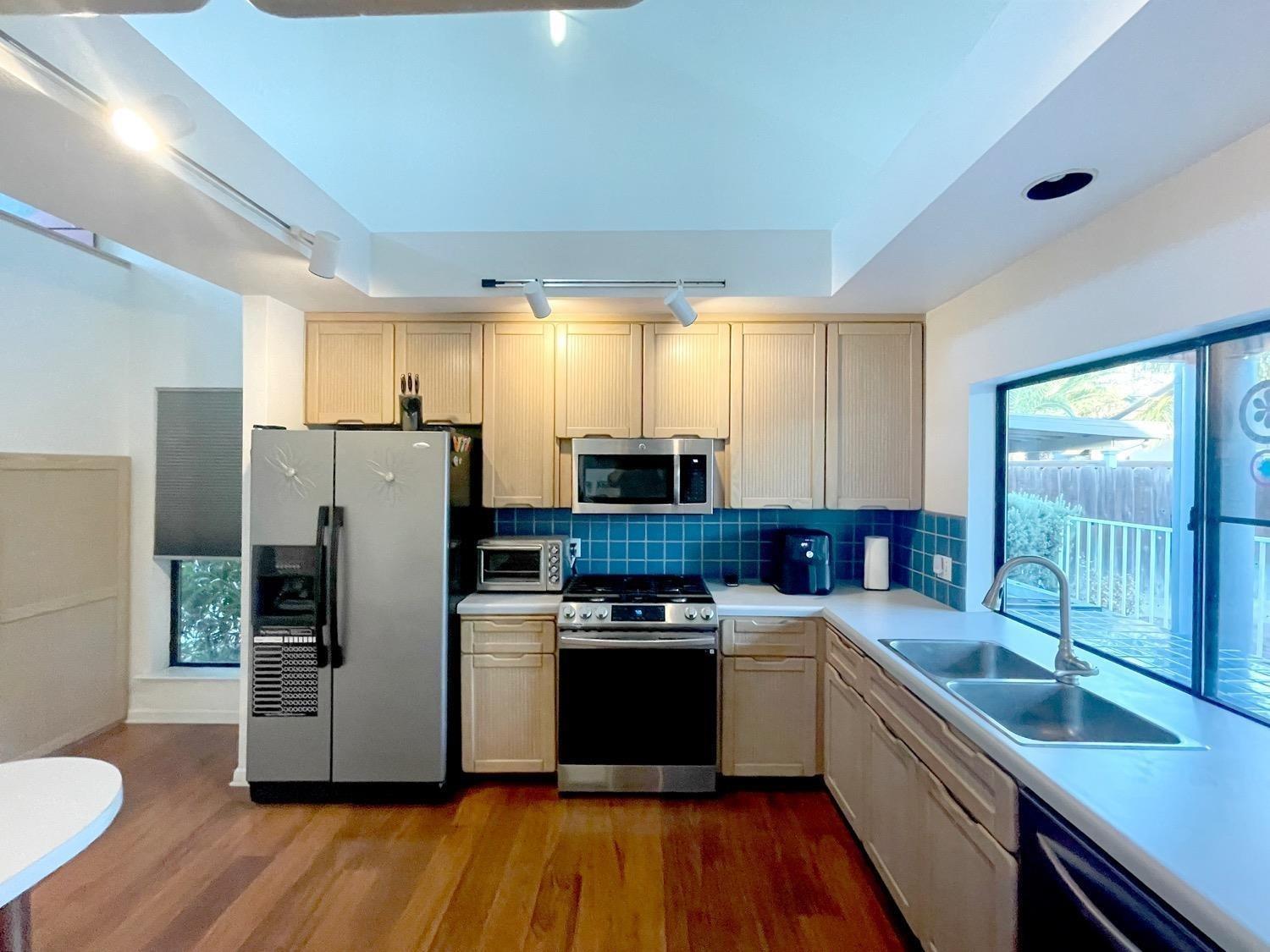1956 Richert Avenue Clovis, CA 93611 - Photo 7 of 18 a kitchen with a refrigerator and a sink