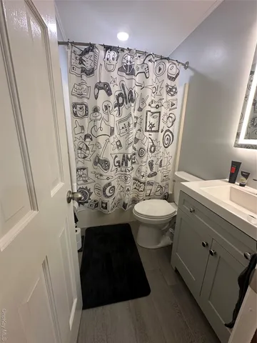 a bedroom with a bed and a mirror