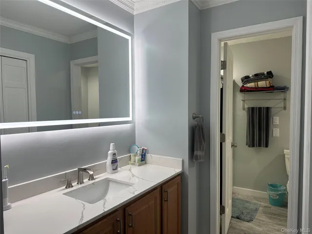 a bedroom with a bed and a television