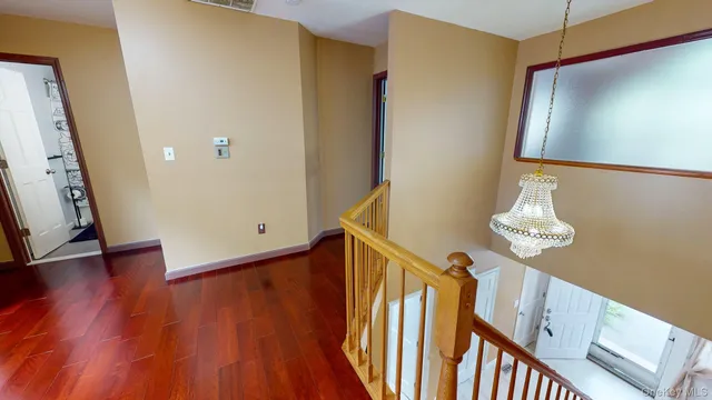 a bedroom with furniture and a flat screen tv