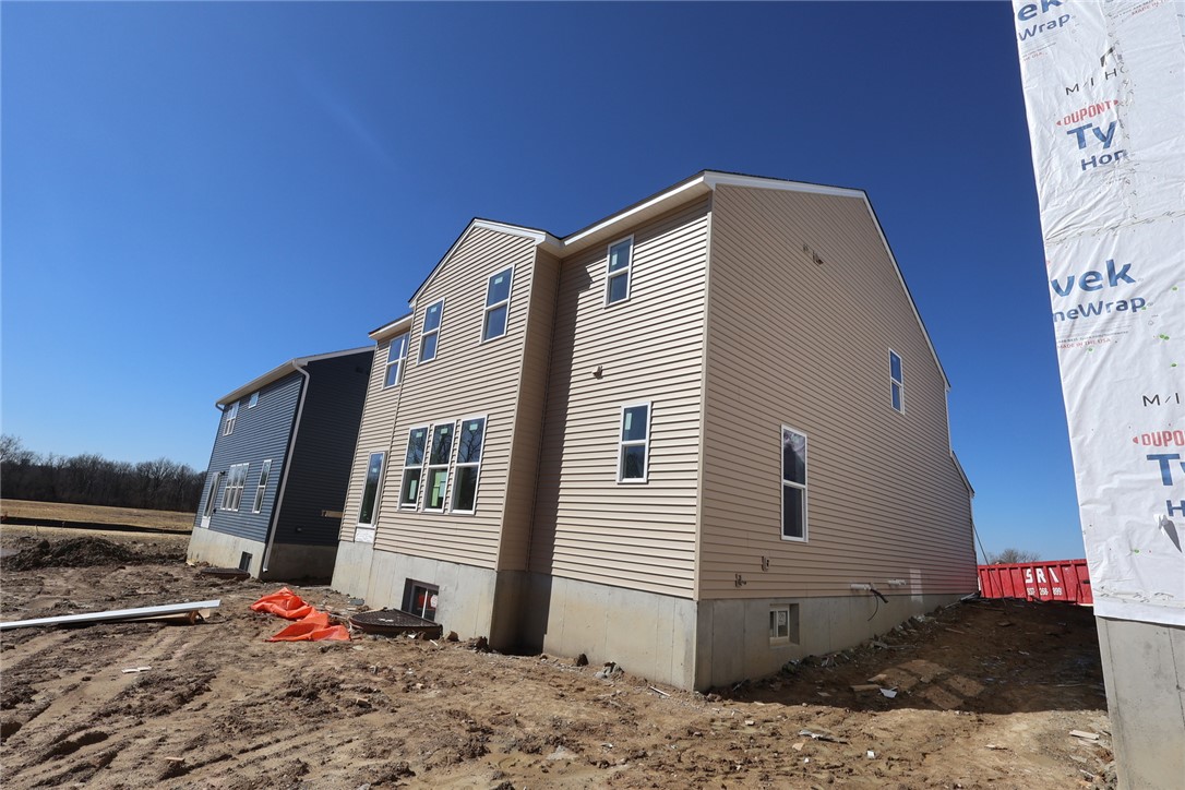 240 Tilly Court, Unit 5 Springboro, OH 45066 - Photo 15 of 26 These newly constructed homes feature durable siding and ample windows under a clear sky.
