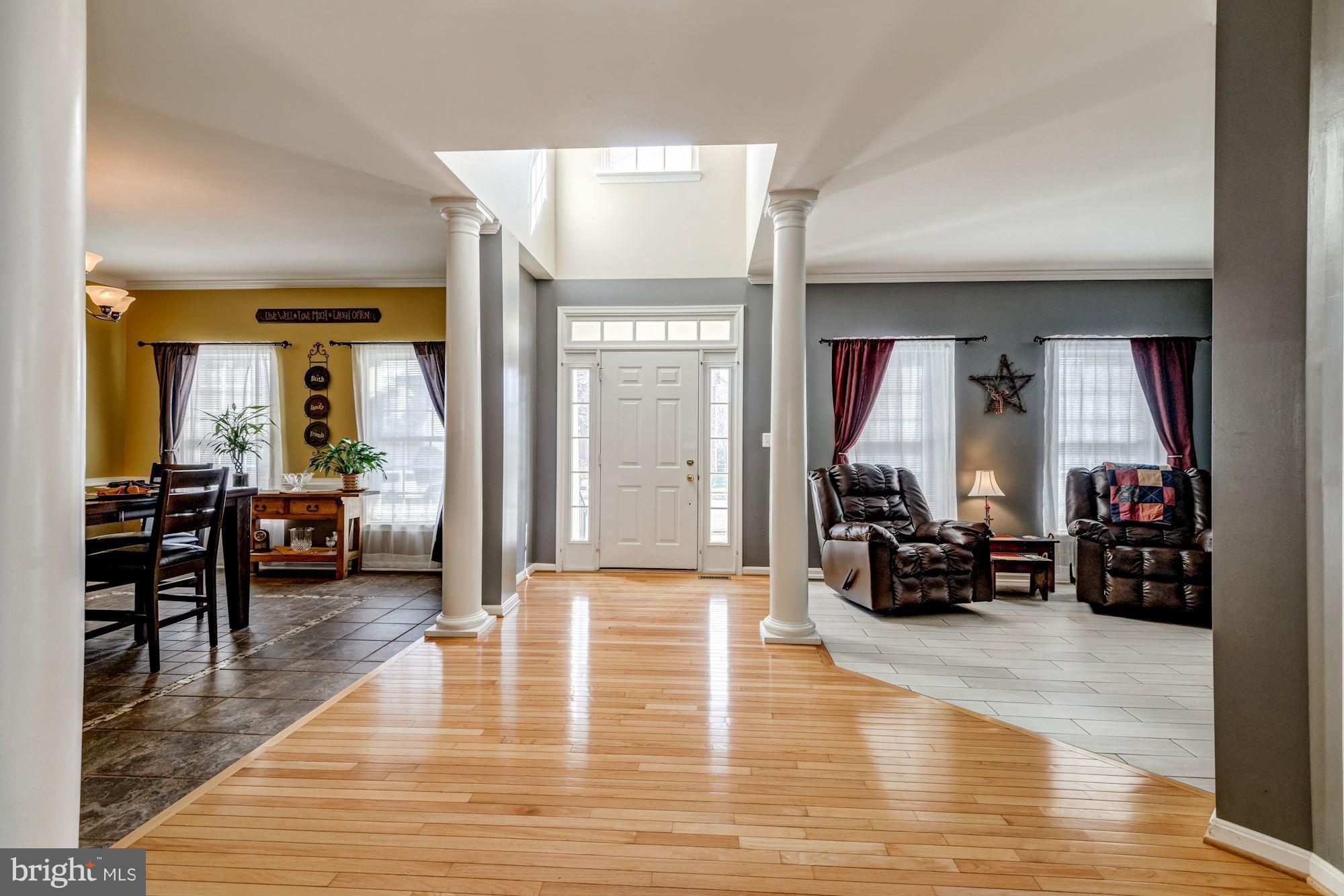 6092 Deer Ridge Trail Springfield, VA 22150 - Photo 2 of 30 a living room with furniture large window and a table