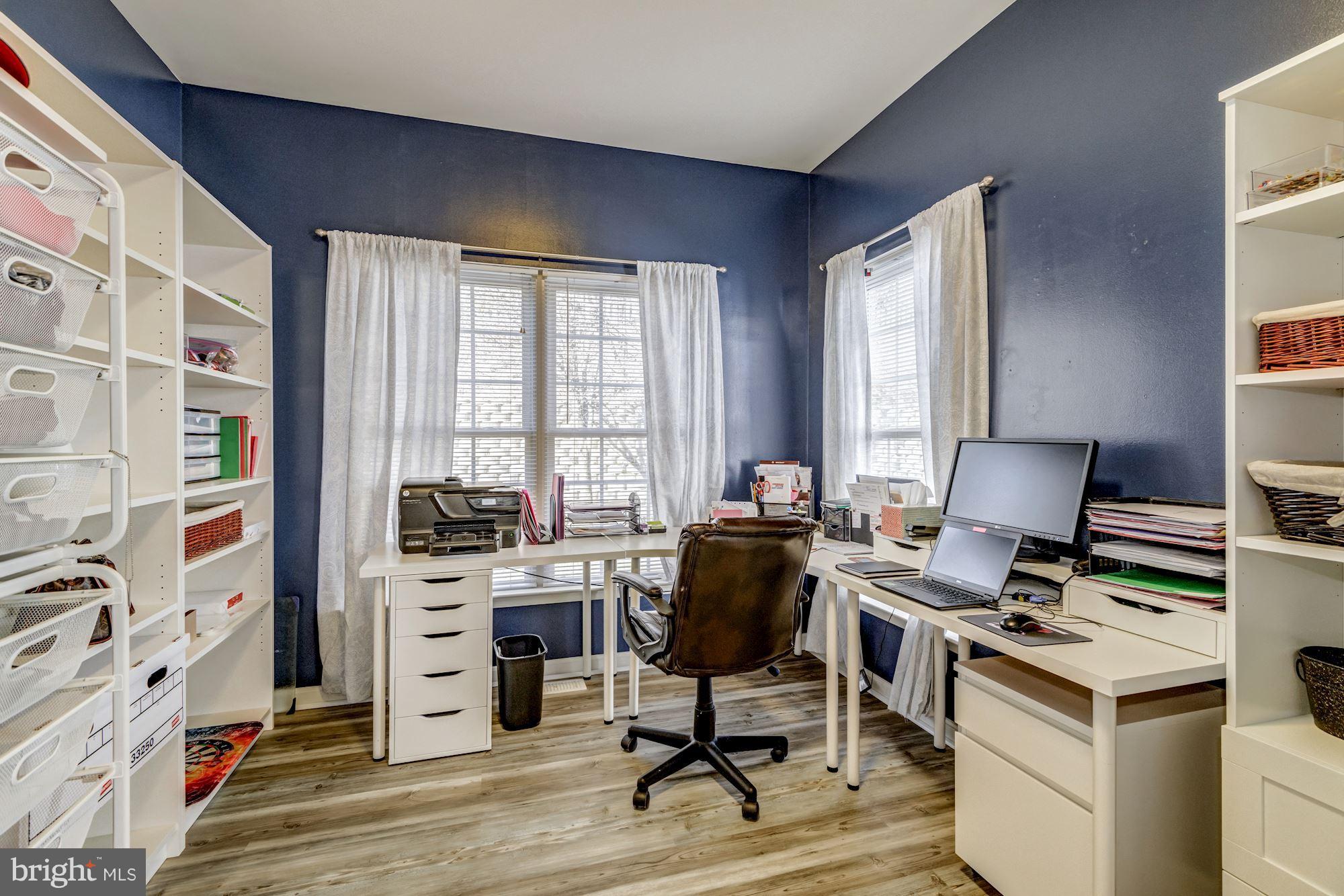 6092 Deer Ridge Trail Springfield, VA 22150 - Photo 12 of 30 a view of a workspace with furniture and a window