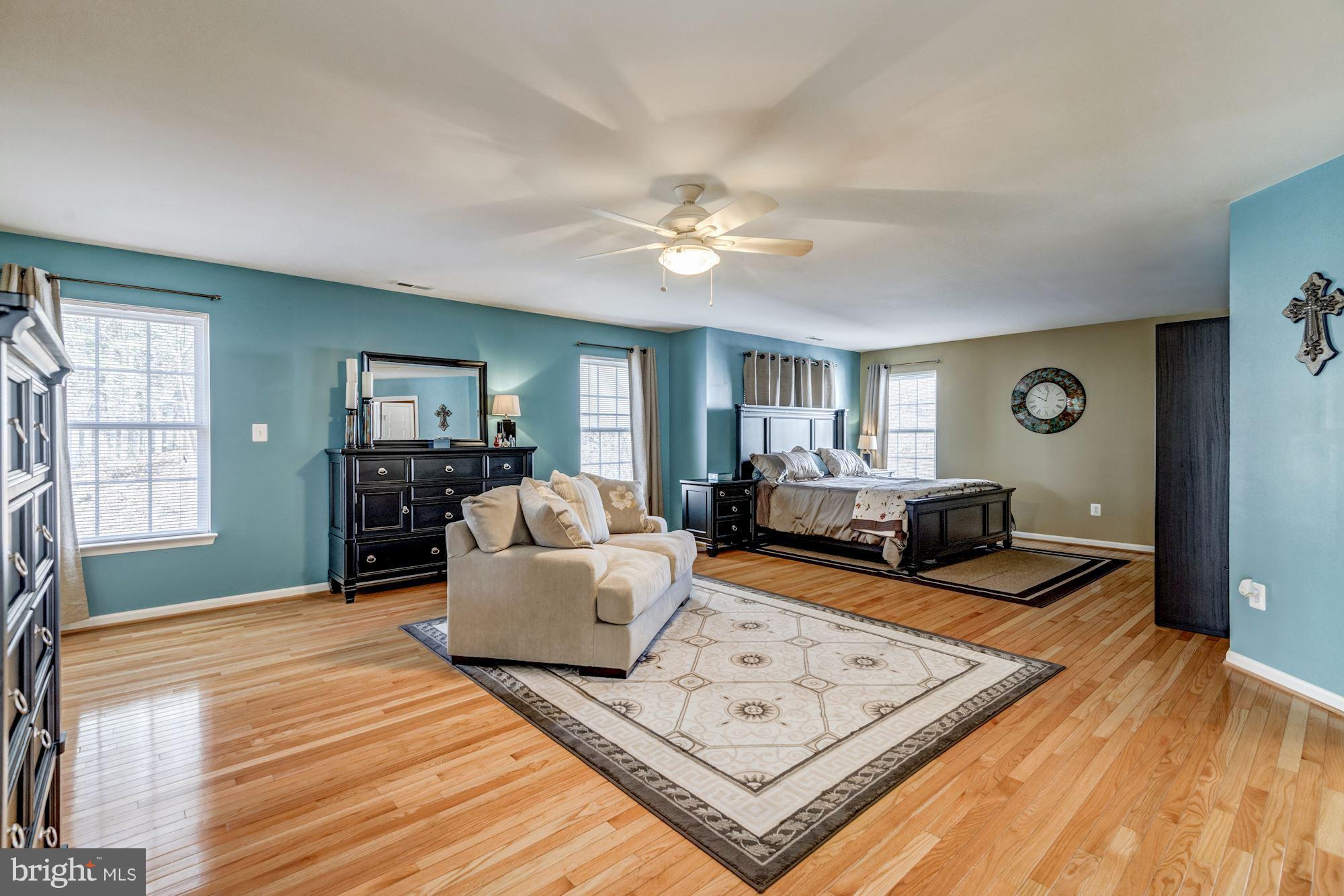 6092 Deer Ridge Trail Springfield, VA 22150 - Photo 15 of 30 a living room with furniture and a wooden floor