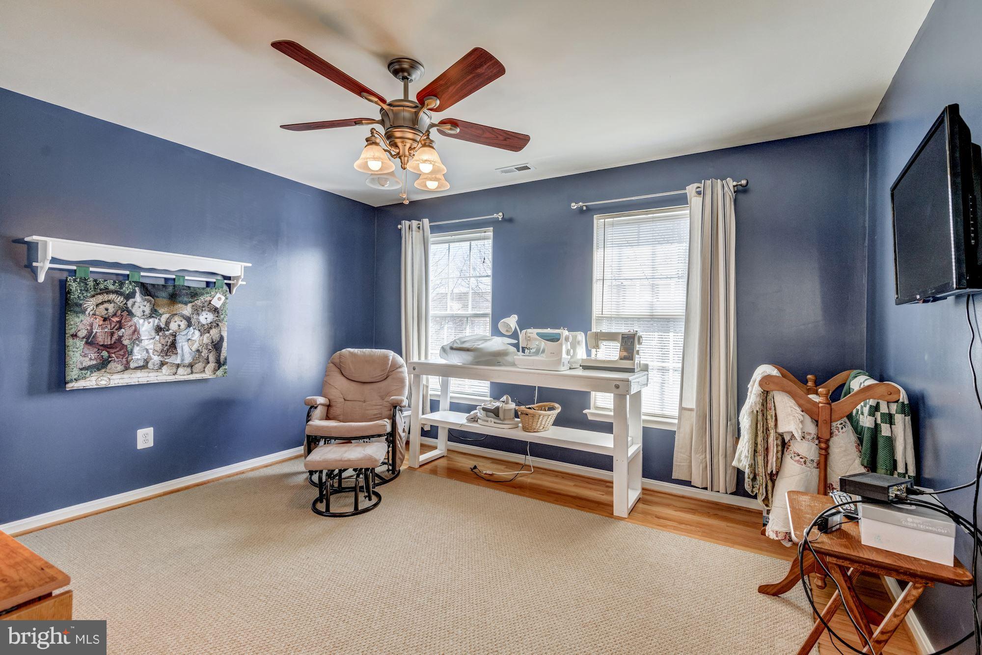6092 Deer Ridge Trail Springfield, VA 22150 - Photo 20 of 30 a room with gym equipment and a window