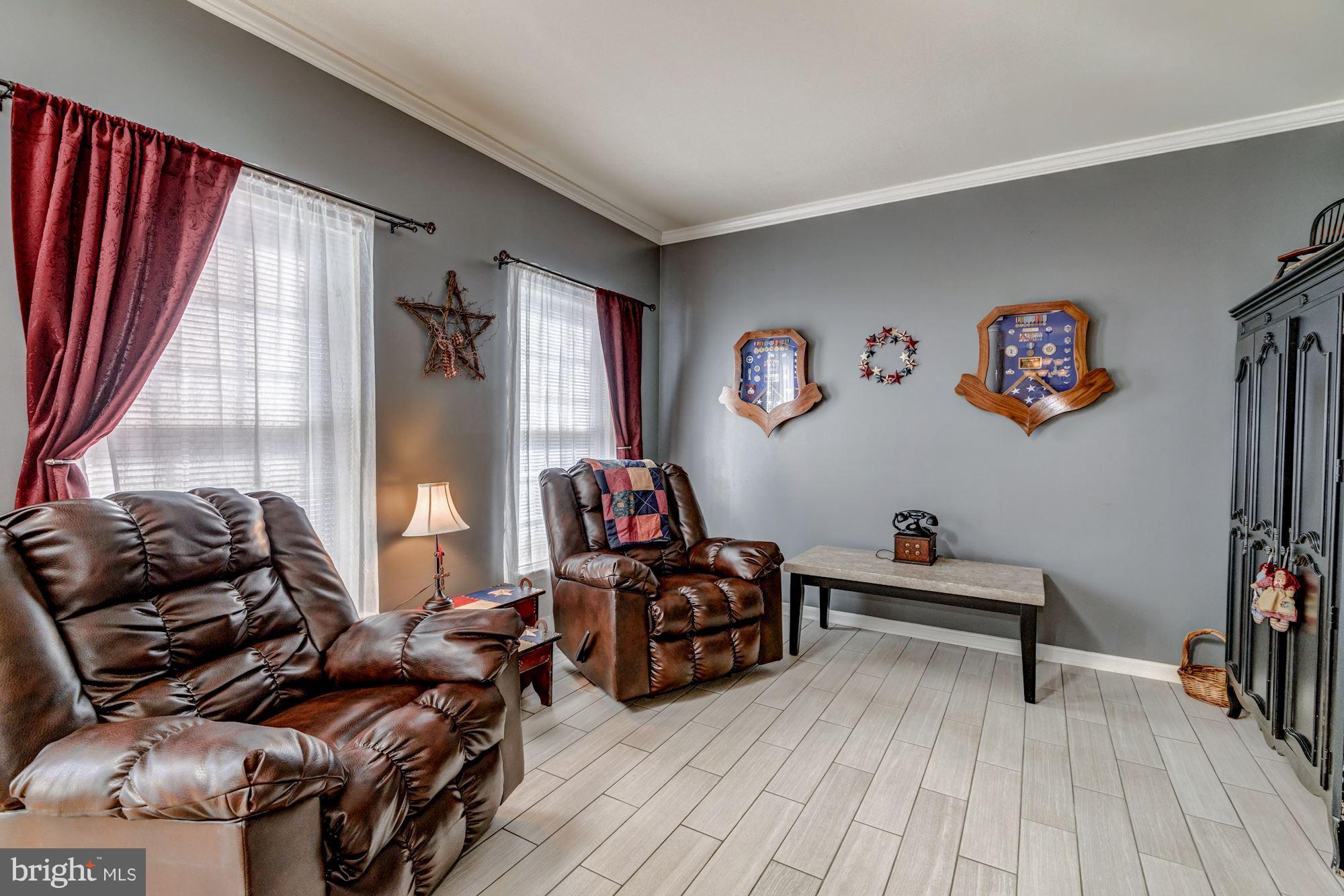6092 Deer Ridge Trail Springfield, VA 22150 - Photo 3 of 30 a living room with furniture and a flat screen tv