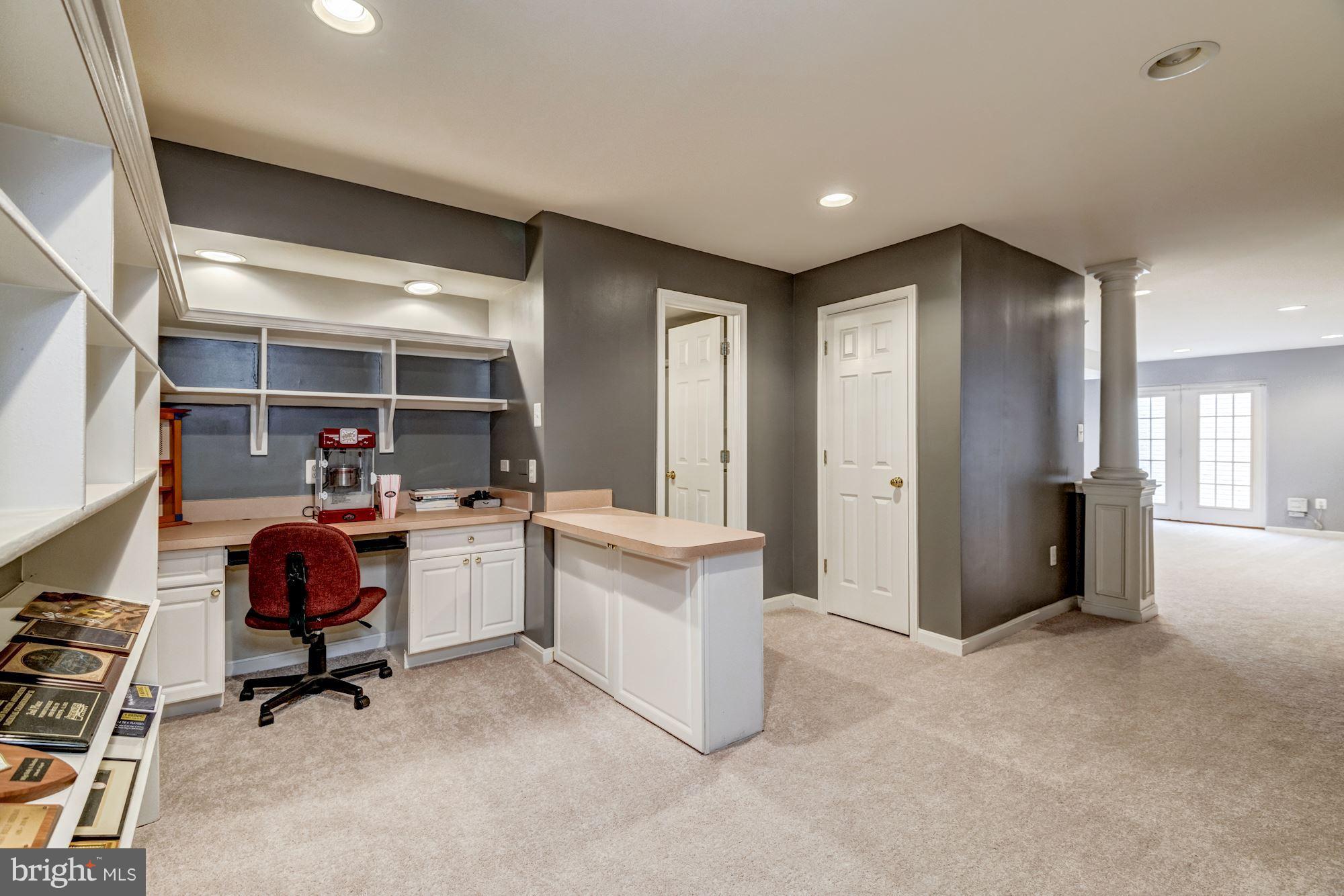 6092 Deer Ridge Trail Springfield, VA 22150 - Photo 25 of 30 a living room with furniture and a gym machine