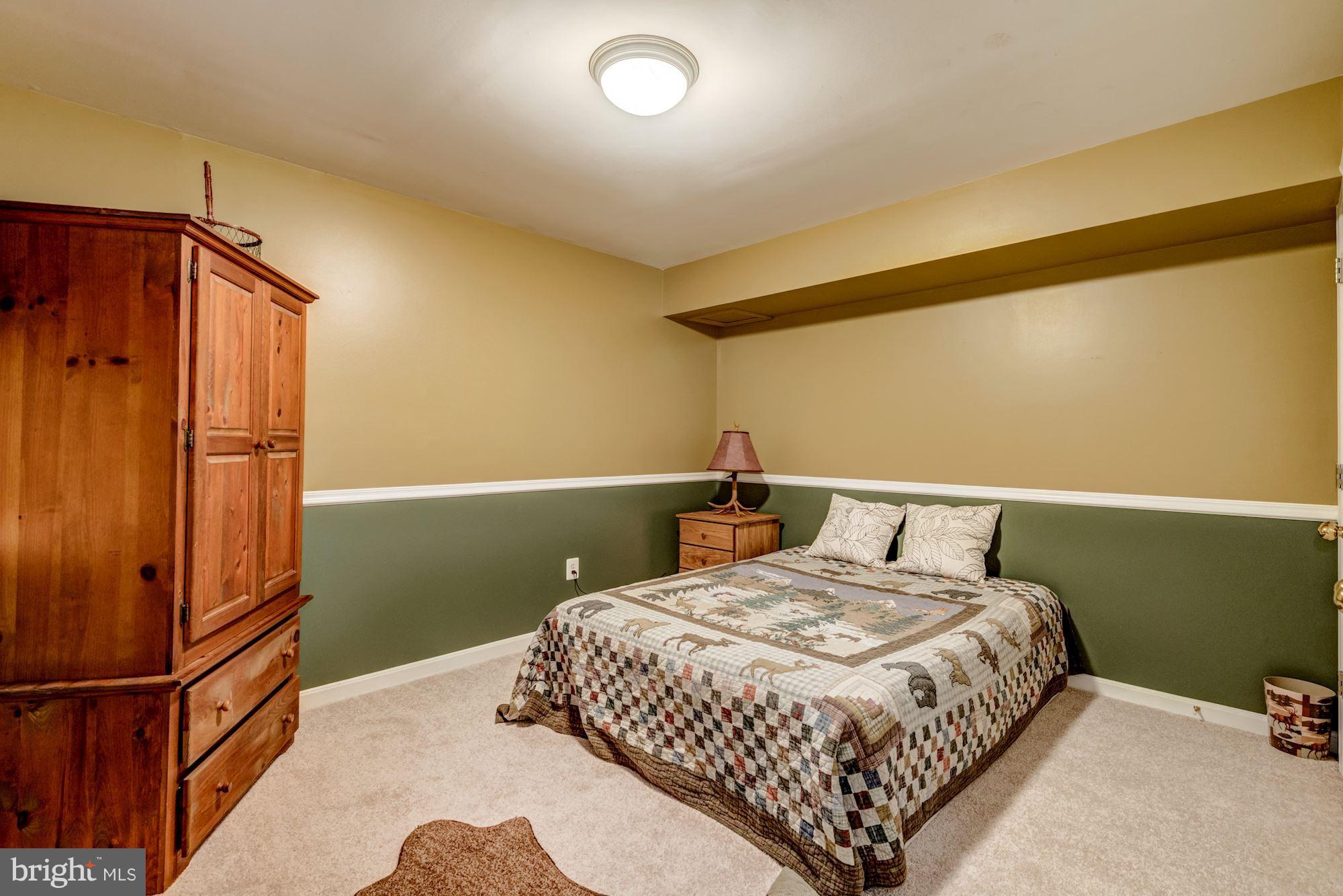 6092 Deer Ridge Trail Springfield, VA 22150 - Photo 26 of 30 a bedroom with a bed and a dresser