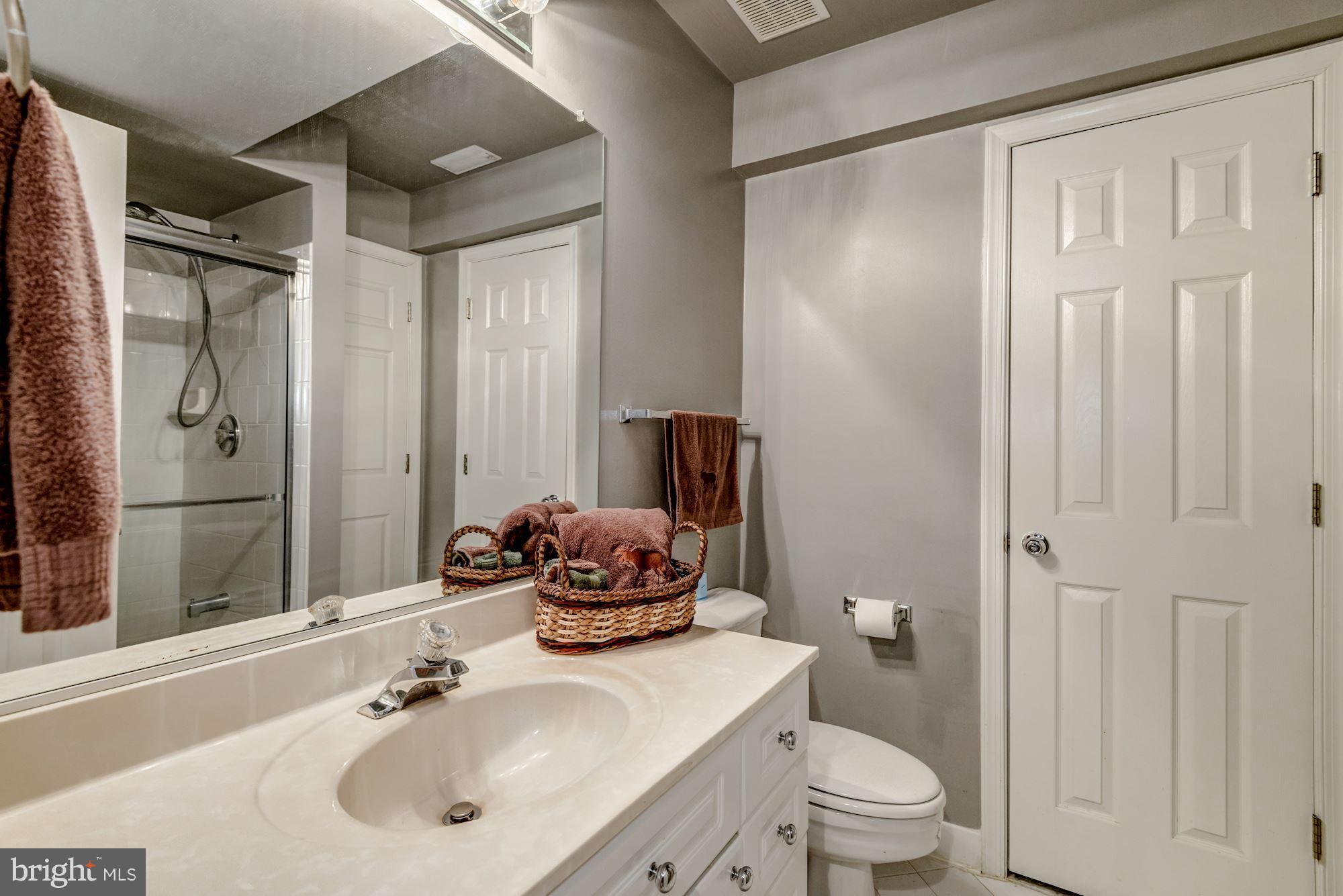 6092 Deer Ridge Trail Springfield, VA 22150 - Photo 28 of 30 a bathroom with a sink toilet and shower