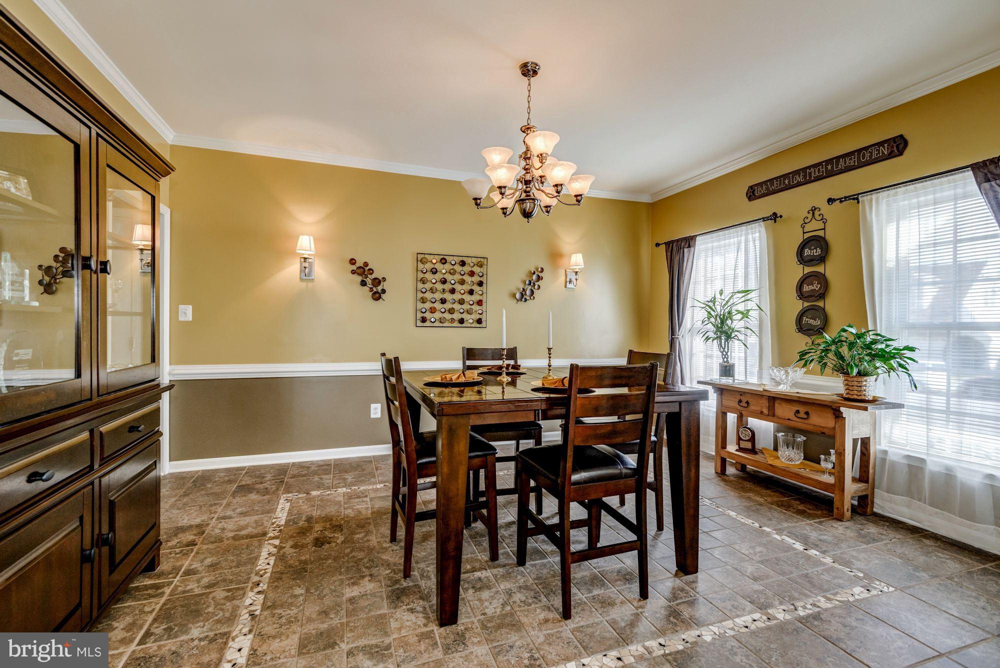 6092 Deer Ridge Trail Springfield, VA 22150 - Photo 4 of 30 a view of a dining room with furniture and a chandelier