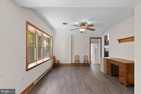 a view of livingroom with furniture fireplace and window