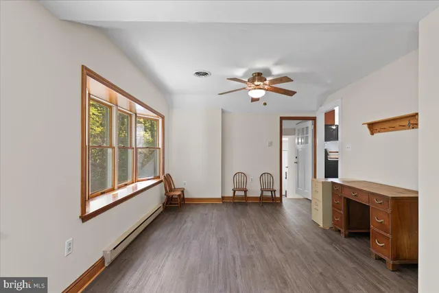 a view of livingroom with furniture fireplace and window