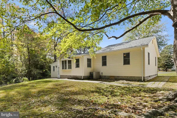 a house with trees in front of it
