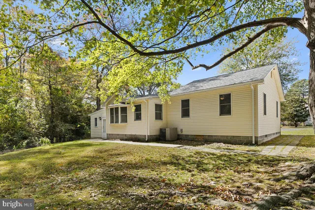 a house with trees in front of it