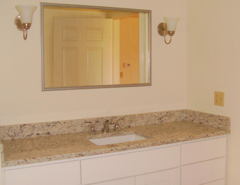 240 Oak Street West Barnstable, MA 02668 - Photo 11 of 19 a bathroom with a granite countertop sink and mirror