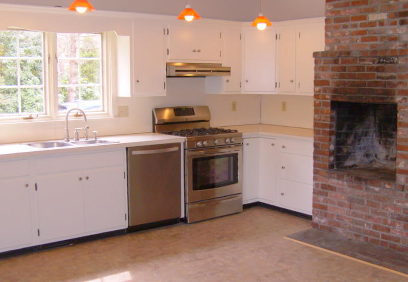 240 Oak Street West Barnstable, MA 02668 - Photo 14 of 19 a kitchen with a stove sink and cabinets