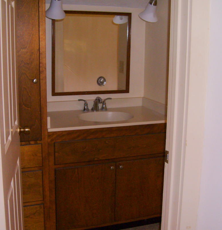 240 Oak Street West Barnstable, MA 02668 - Photo 17 of 19 a bathroom with a sink and a mirror