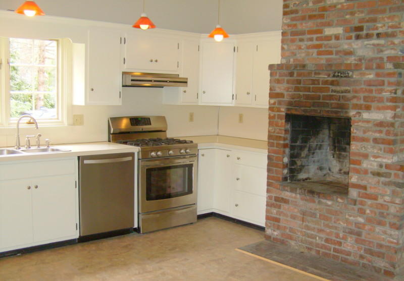 240 Oak Street West Barnstable, MA 02668 - Photo 8 of 19 a kitchen with cabinets stainless steel appliances and a stove