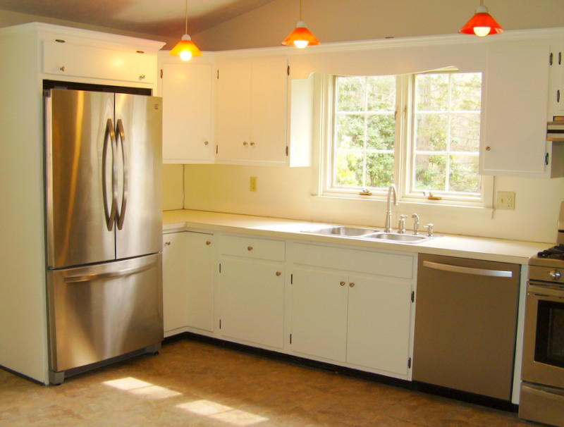240 Oak Street West Barnstable, MA 02668 - Photo 9 of 19 a kitchen with a refrigerator sink and cabinets