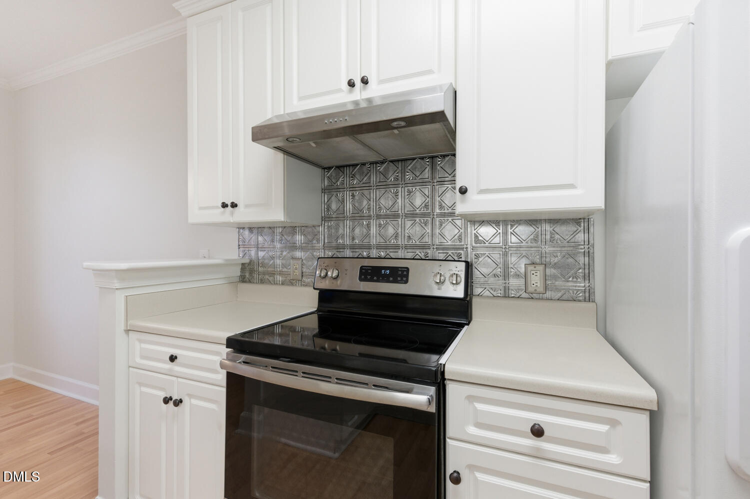 116 Northbrook Drive, Unit 204 Raleigh, NC 27609 - Photo 24 of 94 a kitchen with a stove and white cabinets