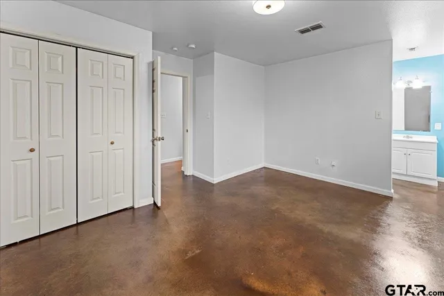 an empty room with wooden floor
