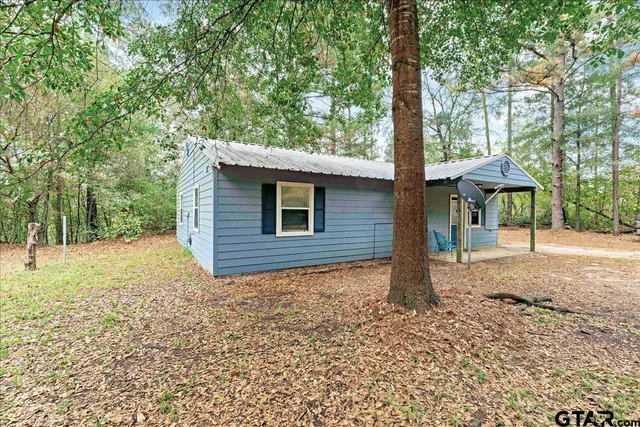 a backyard of a house with lots of green space