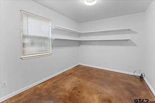 a view of a forest with a street