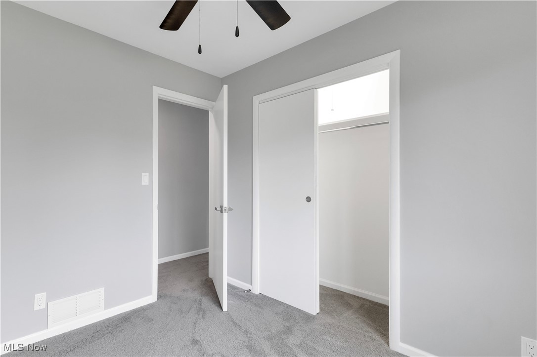 3071 Call Road Stow, OH 44224 - Photo 10 of 25 Unfurnished bedroom featuring a closet, ceiling fan, and light colored carpet