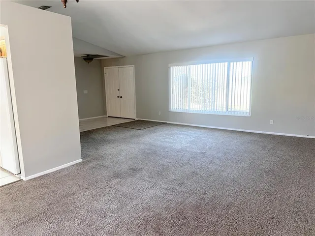a bathroom with a sink and mirror with toilet
