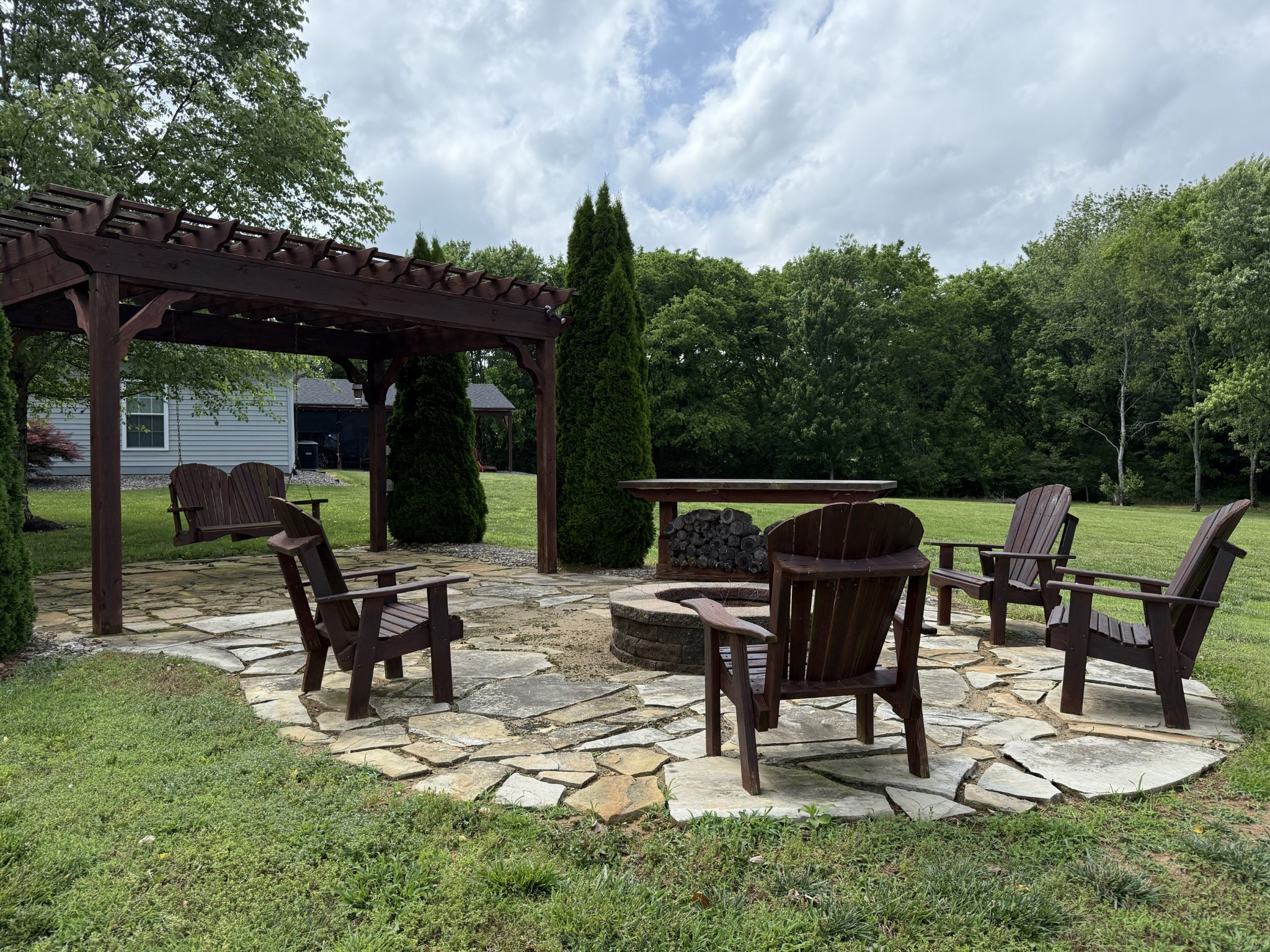 334 North Centerpoint Road Portland, TN 37148 - Photo 6 of 43 a view of backyard with table and chairs and wooden fence