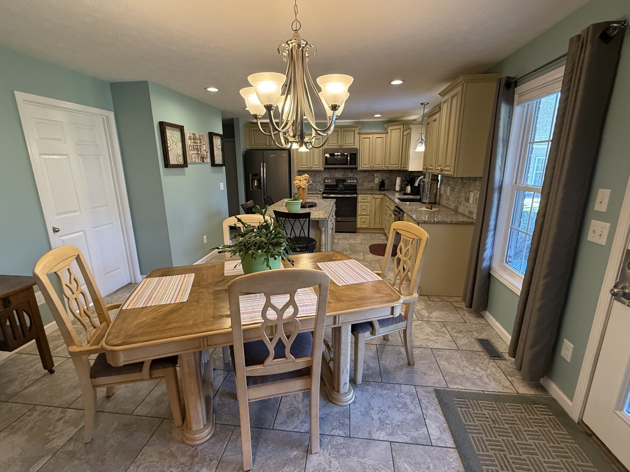 334 North Centerpoint Road Portland, TN 37148 - Photo 9 of 43 a view of a dining room with furniture and a chandelier