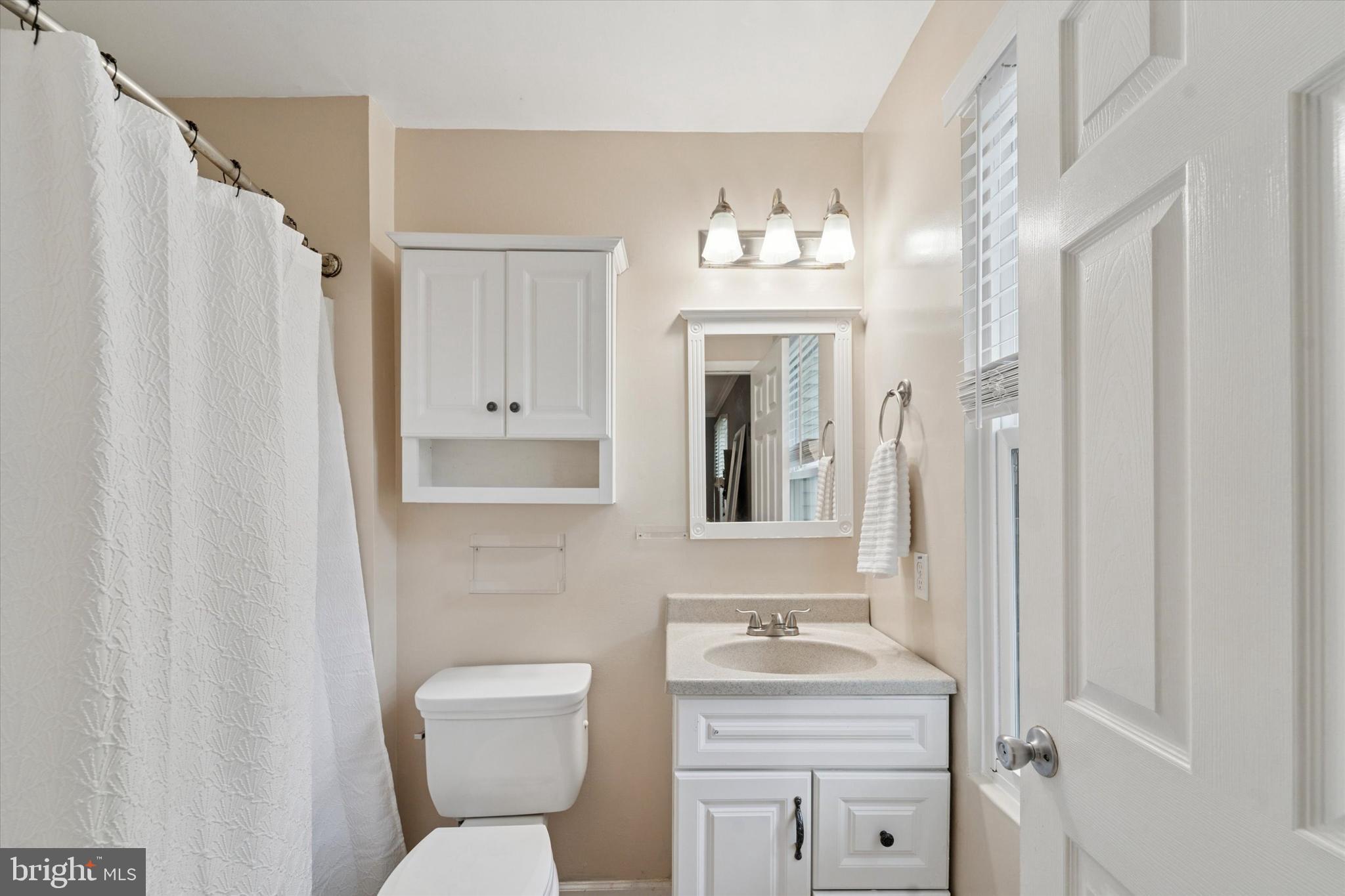 37 Brookview Drive Atco, NJ 08004 - Photo 20 of 27 a bathroom with a toilet sink and mirror