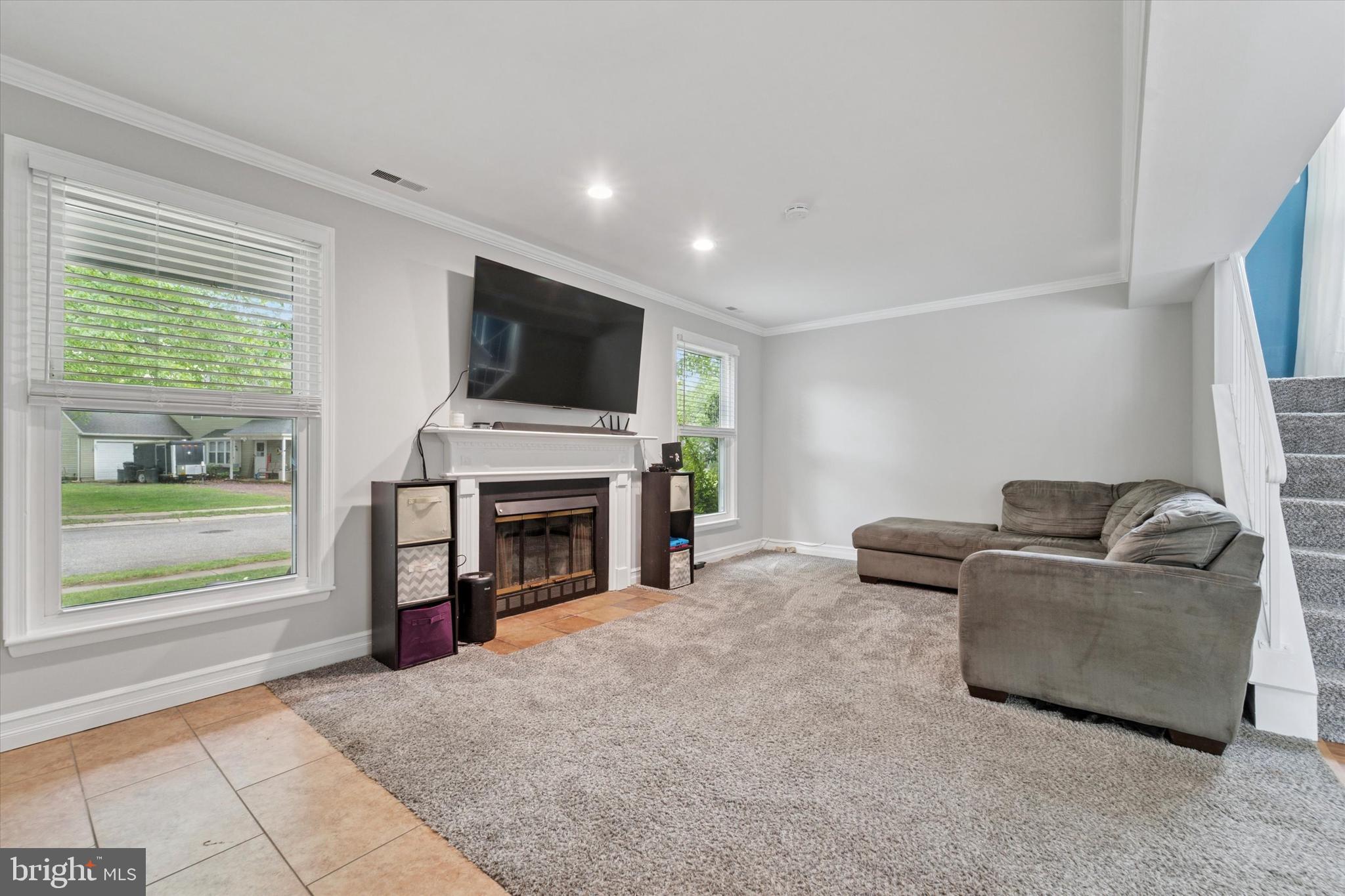 37 Brookview Drive Atco, NJ 08004 - Photo 2 of 27 a living room with furniture a fireplace and a flat screen tv