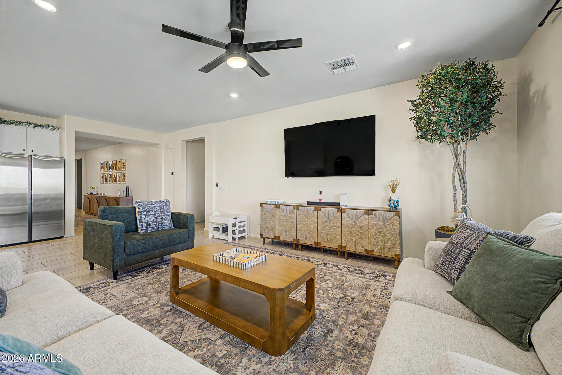 2540 West Grenadine Road Phoenix, AZ 85041 - Photo 13 of 69 Living room toward Owner Suite