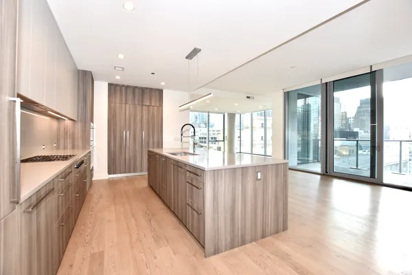 a view of a floor to ceiling window and wooden floor
