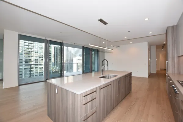 a view of an empty room with glass door