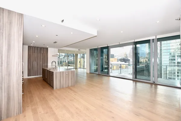 a view of a kitchen with a sink and cabinets